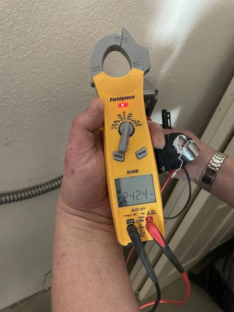 Voltage testing with clamp meter during Recessed Lighting Installation in Jennings Lodge